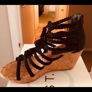 Black tassel wedge sandals